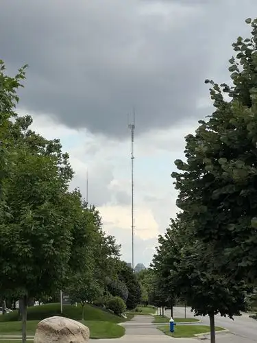 Towering above the grey skies.